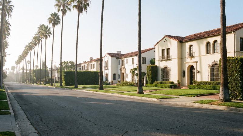 A palm-lined street of 1920s Spanish Colonial Revival houses in the Beverly Hills flats