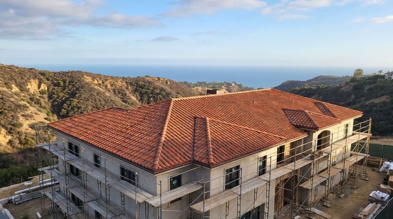 A rebuilt Pacific Palisades house with a new fire-resistant tile roof