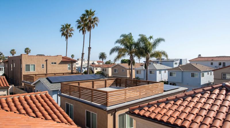 A Santa Monica street of Spanish tile roofs and flat modern roof decks