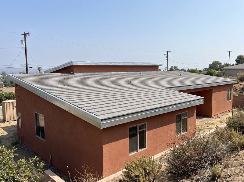 A newly completed fire-resistant roof of flat concrete tiles